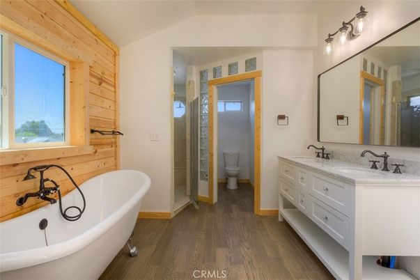 Bathroom, Dual Sink Vanities, Free Standing Baths, Interior, Wood Texture Flooring, Wooden Walls