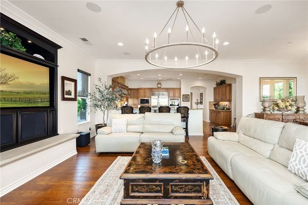 Chandelier, Interior, Kitchen, Living room, Pendant Lights, Recessed Lighting, Stainless Steel Appliances, Wood Texture Flooring