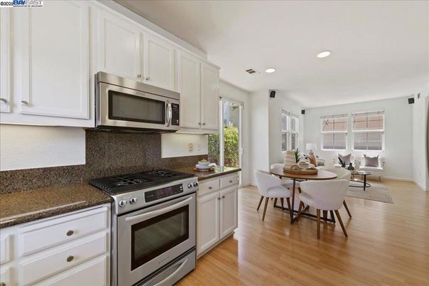 Dining room, Interior, Kitchen, Recessed Lighting, Stainless Steel Appliances, Wood Texture Flooring