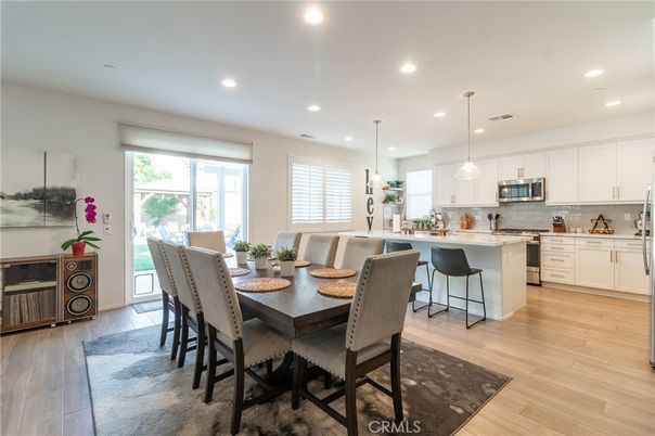 Dining room, Interior, Kitchen, Pendant Lights, Recessed Lighting, Stainless Steel Appliances, Wood Texture Flooring