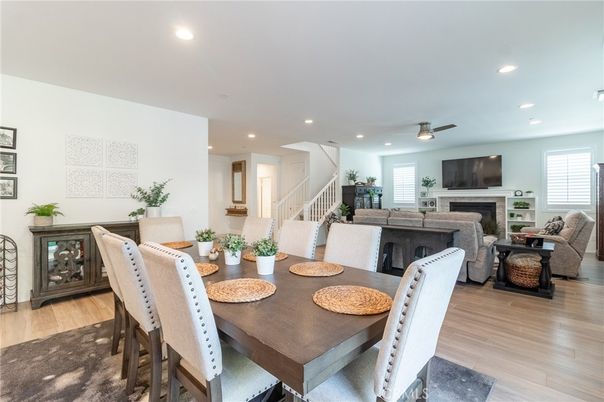 Dining room, Fireplace, Interior, Living room, Recessed Lighting, Wood Texture Flooring