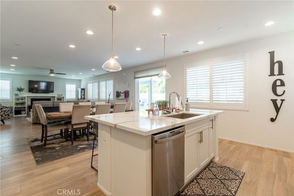 Dining room, Fireplace, Interior, Kitchen, Pendant Lights, Recessed Lighting, Stainless Steel Appliances, Wood Texture Flooring