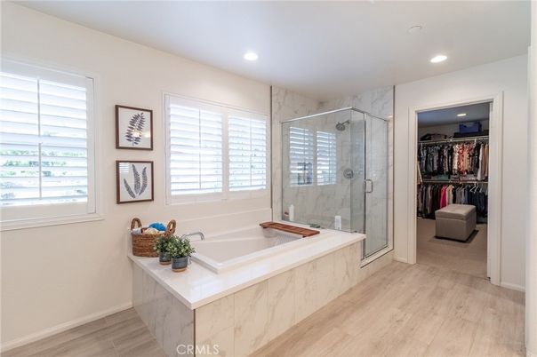 Bathroom, Glass Shower, Interior, Marble Walls, Recessed Lighting, Walk-in Closets, Wood Texture Flooring