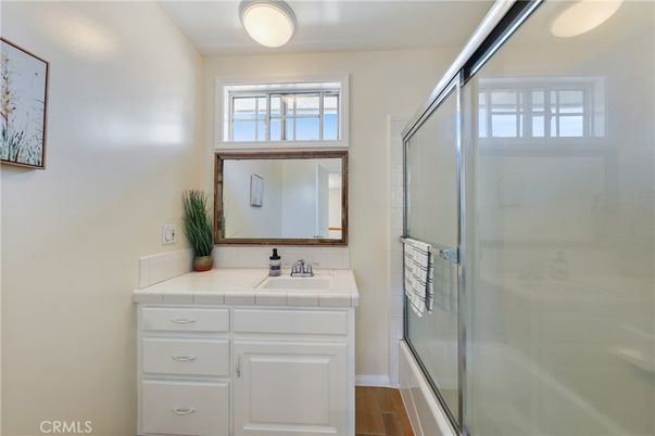 Bathroom, Glass Shower, Interior, Tile Countertops, Wood Texture Flooring