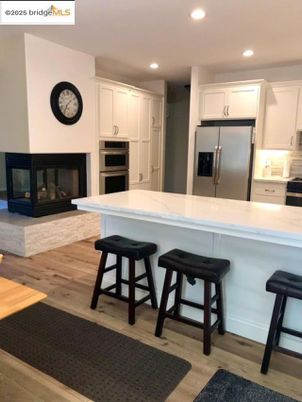 Fireplace, Interior, Kitchen, Recessed Lighting, Wood Texture Flooring
