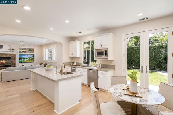 Dining room, Fireplace, Interior, Kitchen, Living room, Recessed Lighting, Wood Texture Flooring