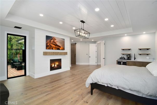 Bedroom, Fireplace, Interior, Pendant Lights, Recessed Lighting, Wood Texture Flooring