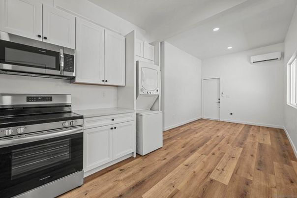 Interior, Kitchen, Recessed Lighting, Stainless Steel Appliances, Washer, Wood Texture Flooring
