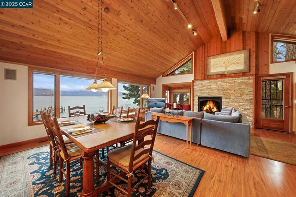 Dining room, Fireplace, Interior, Living room, Pendant Lights, Water, Wooden Beams, Wooden Ceilings, Wood Texture Flooring, Wooden Walls