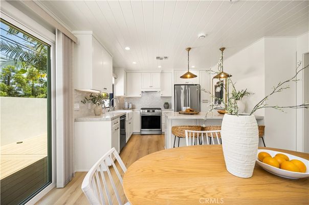 Dining room, Interior, Kitchen, Pendant Lights, Recessed Lighting, Stainless Steel Appliances, Wood Texture Flooring