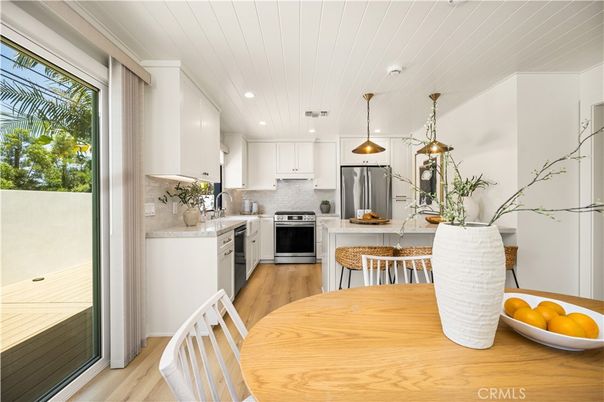 Dining room, Interior, Kitchen, Pendant Lights, Recessed Lighting, Stainless Steel Appliances, Wood Texture Flooring