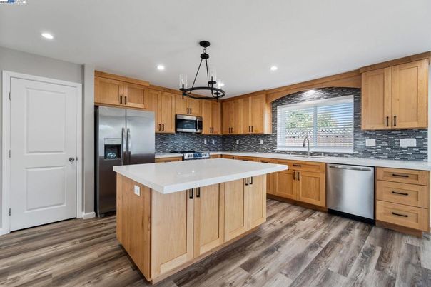 Interior, Kitchen, Pendant Lights, Recessed Lighting, Stainless Steel Appliances, Wood Texture Flooring