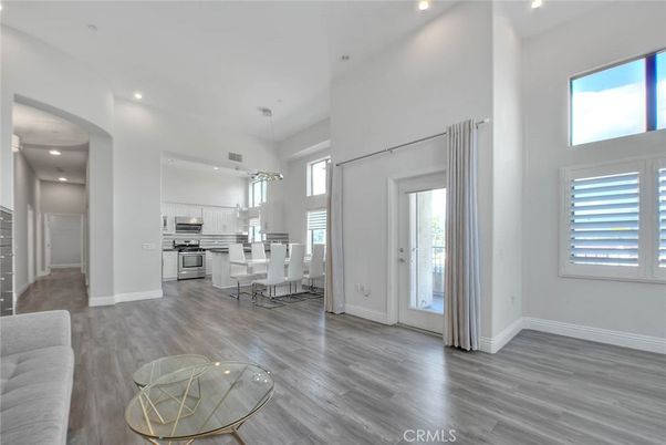 Chandelier, Dining room, Interior, Kitchen, Pendant Lights, Recessed Lighting, Stainless Steel Appliances, Wood Texture Flooring