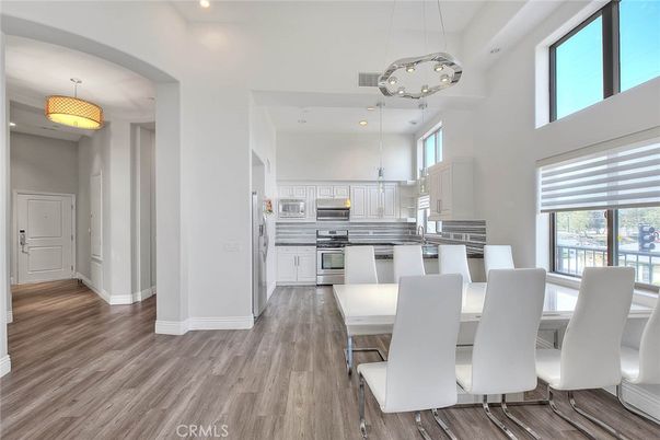Dining room, Interior, Kitchen, Pendant Lights, Recessed Lighting, Stainless Steel Appliances, Wood Texture Flooring