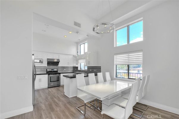Dining room, Interior, Kitchen, Pendant Lights, Recessed Lighting, Stainless Steel Appliances, Wood Texture Flooring