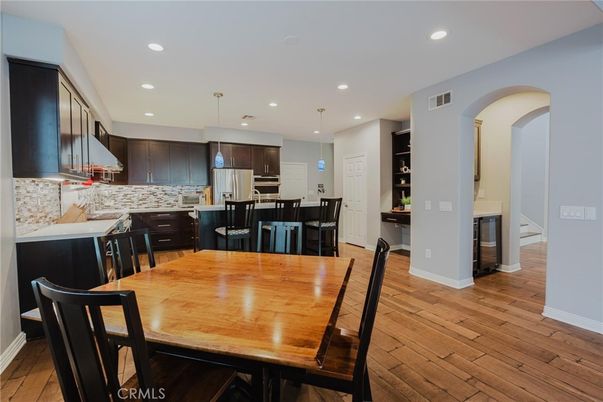 Dining room, Interior, Kitchen, Pendant Lights, Recessed Lighting, Stainless Steel Appliances, Wood Texture Flooring