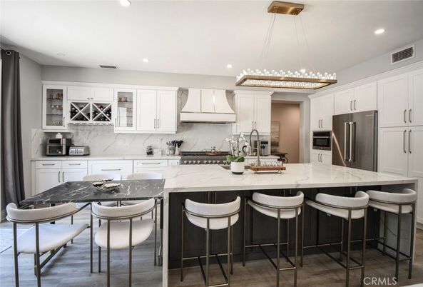 Interior, Kitchen, Marble Walls, Pendant Lights, Recessed Lighting, Stainless Steel Appliances