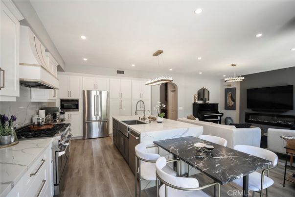 Dining room, Interior, Kitchen, Pendant Lights, Recessed Lighting, Stainless Steel Appliances, Wood Texture Flooring