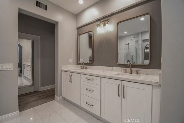 Bathroom, Dual Sink Vanities, Interior, Marble, Recessed Lighting, Wood Texture Flooring