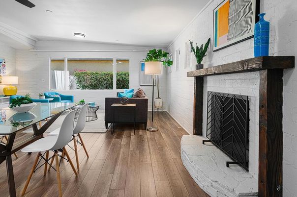 Dining room, Fireplace, Interior, Living room, Recessed Lighting, Stone Walls, Wood Texture Flooring
