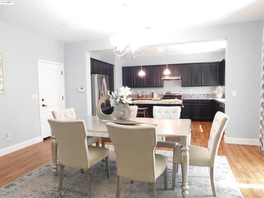 Chandelier, Dining room, Interior, Kitchen, Pendant Lights, Stainless Steel Appliances, Wood Texture Flooring