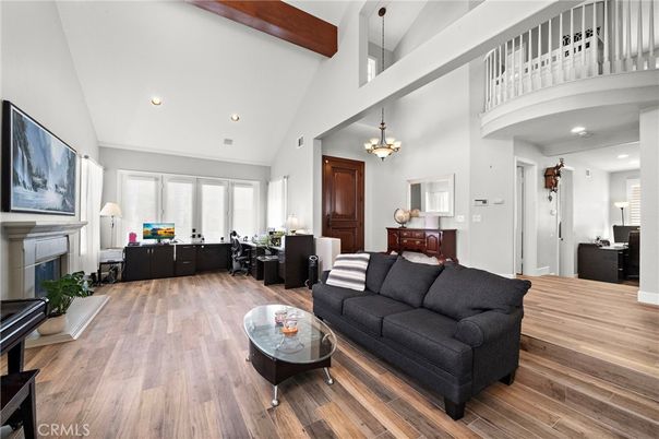 Chandelier, Fireplace, Interior, Living room, Pendant Lights, Recessed Lighting, Wooden Beams, Wood Texture Flooring