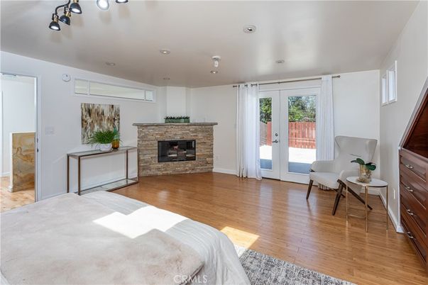 Bedroom, Fireplace, Interior, Recessed Lighting, Wood Texture Flooring