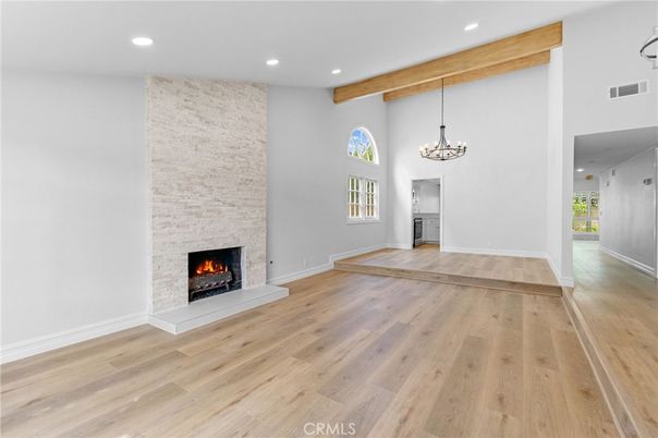 Chandelier, Empty room, Fireplace, Interior, Recessed Lighting, Wooden Beams, Wood Texture Flooring