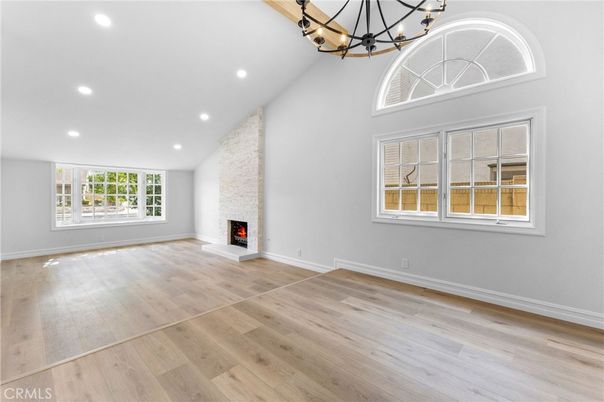 Chandelier, Empty room, Fireplace, Interior, Recessed Lighting, Wood Texture Flooring