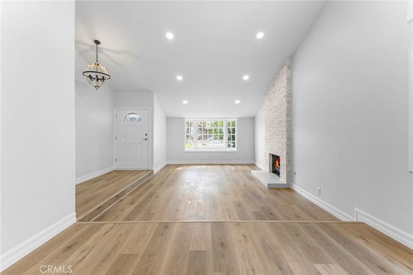 Empty room, Fireplace, Interior, Pendant Lights, Recessed Lighting, Wood Texture Flooring