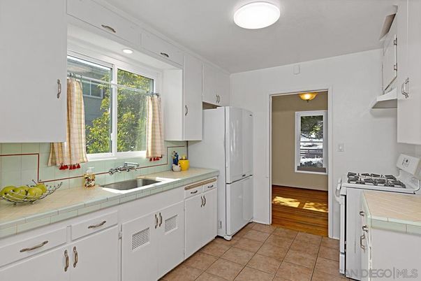 Interior, Kitchen, Recessed Lighting, Tile Countertops, Wood Texture Flooring