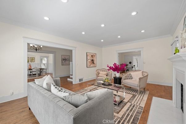 Chandelier, Dining room, Fireplace, Interior, Living room, Recessed Lighting, Wood Texture Flooring