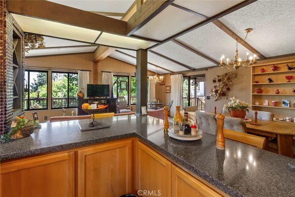 Chandelier, Dining room, Fireplace, Interior, Wooden Beams