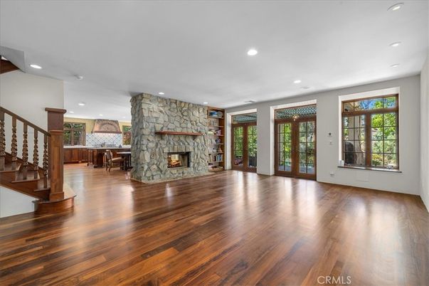 Empty room, Fireplace, Interior, Recessed Lighting, Stone Walls, Wood Texture Flooring