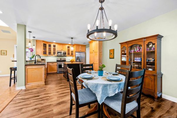 Chandelier, Dining room, Interior, Kitchen, Pendant Lights, Recessed Lighting, Stainless Steel Appliances, Wood Texture Flooring