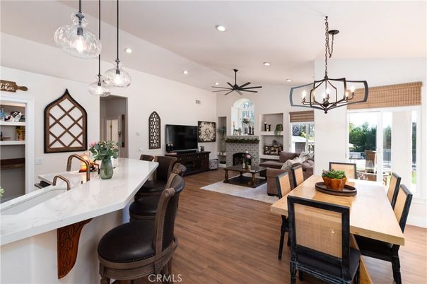 Chandelier, Dining room, Fireplace, Interior, Living room, Pendant Lights, Recessed Lighting, Wood Texture Flooring