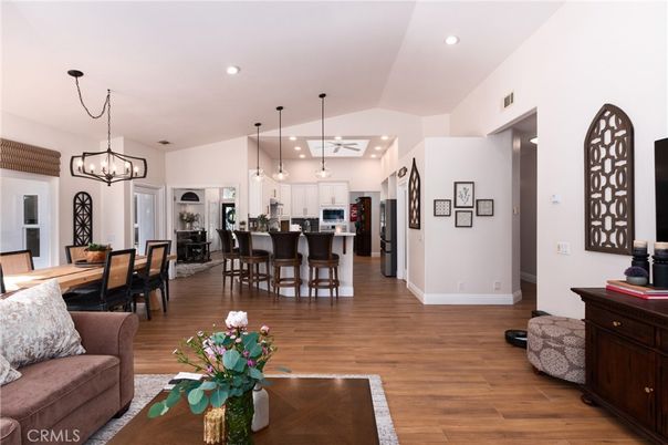 Chandelier, Dining room, Interior, Kitchen, Living room, Pendant Lights, Recessed Lighting, Stainless Steel Appliances, Wood Texture Flooring