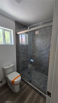 Bathroom, Glass Shower, Interior, Marble Walls, Wood Texture Flooring