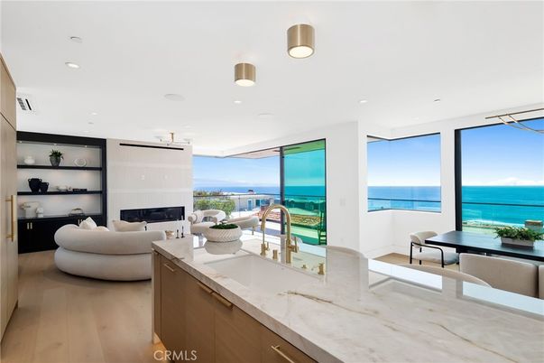 Fireplace, Interior, Kitchen, Living room, Pendant Lights, Recessed Lighting, Water, Wood Texture Flooring