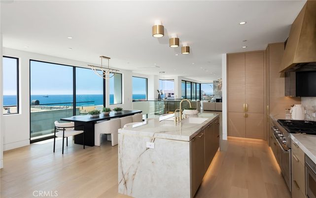 Dining room, Interior, Kitchen, Pendant Lights, Recessed Lighting, Stainless Steel Appliances, Water, Wood Texture Flooring