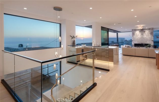 Fireplace, Interior, Living room, Pendant Lights, Recessed Lighting, Water, Wood Texture Flooring