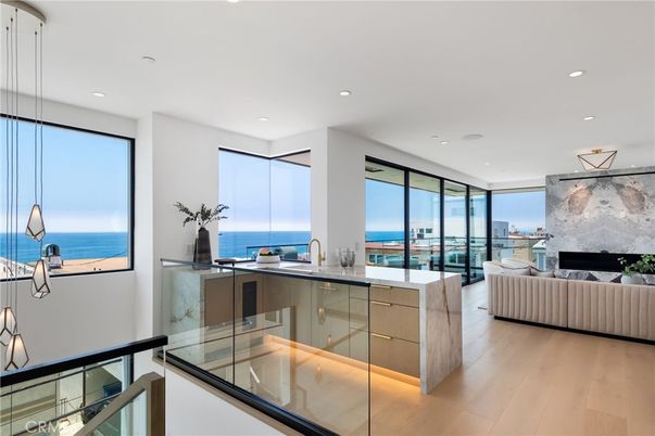 Fireplace, Interior, Kitchen, Living room, Pendant Lights, Recessed Lighting, Water, Wood Texture Flooring
