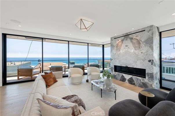 Fireplace, Interior, Living room, Marble Walls, Recessed Lighting, Water, Wood Texture Flooring