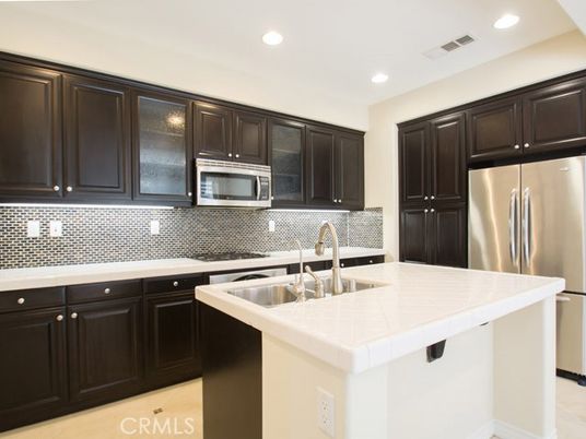 Interior, Kitchen, Recessed Lighting, Stainless Steel Appliances, Tile Countertops