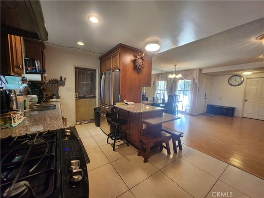 Chandelier, Dining room, Interior, Kitchen, Recessed Lighting, Stainless Steel Appliances, Wood Texture Flooring