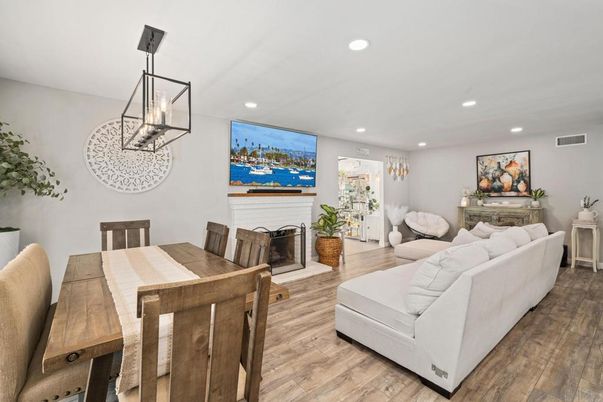 Dining room, Fireplace, Interior, Living room, Pendant Lights, Recessed Lighting, Wood Texture Flooring