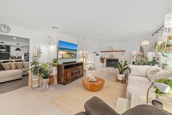 Fireplace, Interior, Kitchen, Living room, Pendant Lights, Recessed Lighting, Stainless Steel Appliances, Wood Texture Flooring