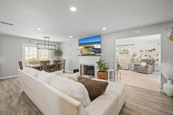 Dining room, Fireplace, Interior, Living room, Pendant Lights, Recessed Lighting, Wood Texture Flooring