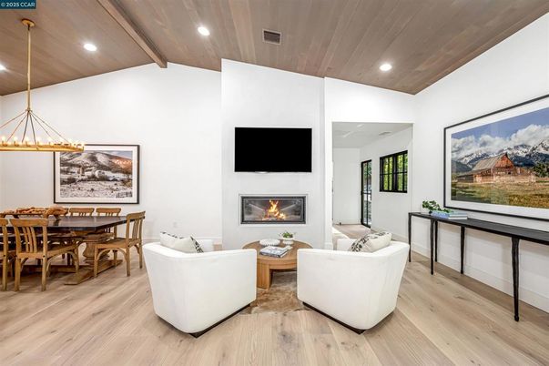 Dining room, Fireplace, Interior, Living room, Pendant Lights, Recessed Lighting, Wooden Ceilings, Wood Texture Flooring