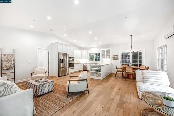 Chandelier, Dining room, Interior, Kitchen, Living room, Pendant Lights, Recessed Lighting, Stainless Steel Appliances, Wood Texture Flooring